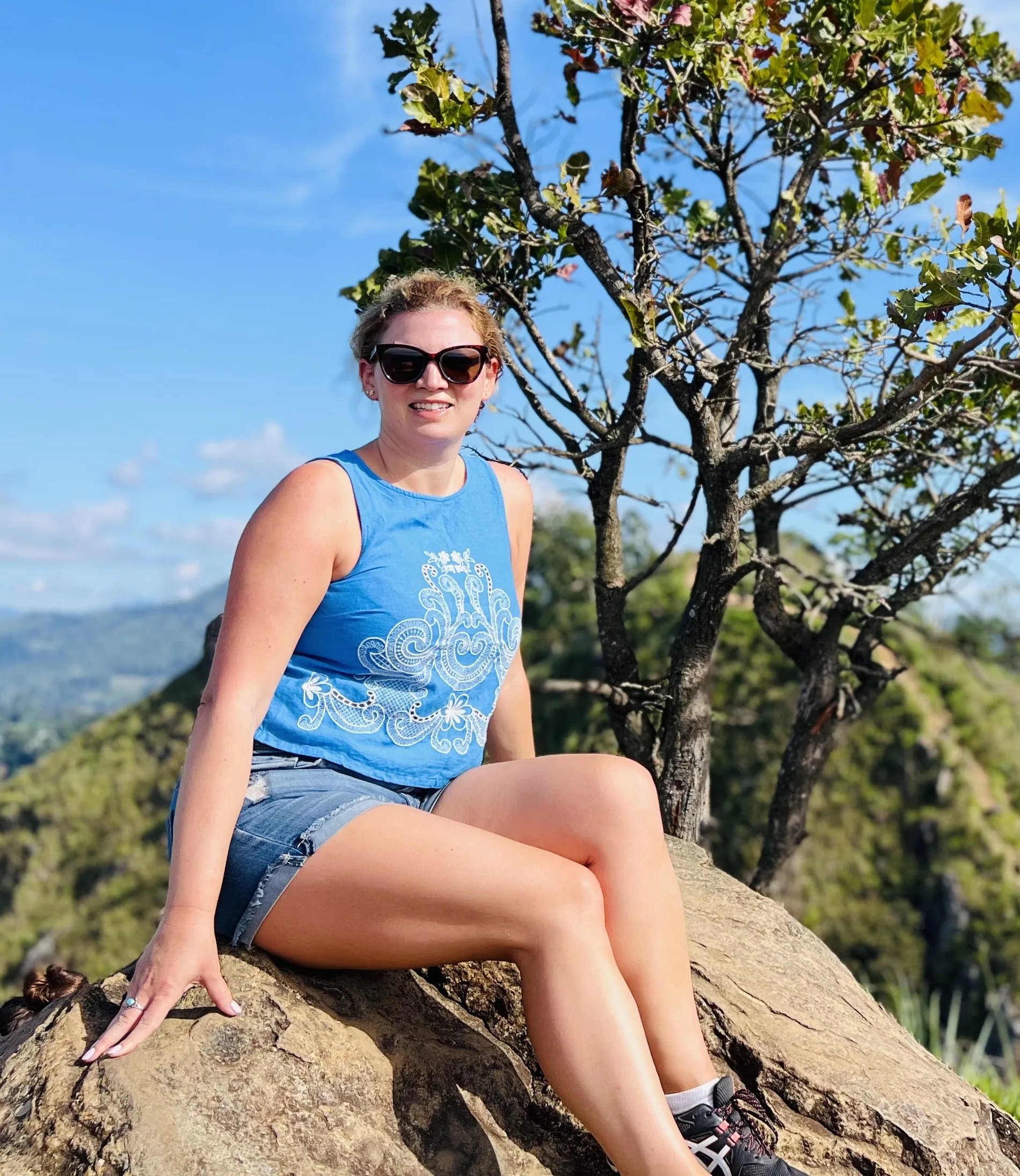 Traveler sitting on Ella Rock